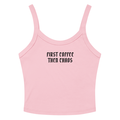 "First Coffee  Then Chaos" printed on a solid pink blend women's micro-rib tanktop laying on a flat surface amongst sunglasses and shorts
