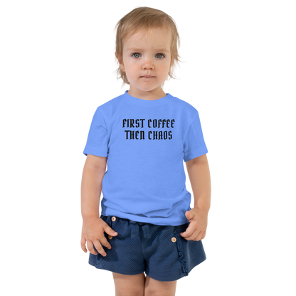 "First Coffee  Then Chaos" printed on a heather columbia blue toddler short sleeve tee worn by a female