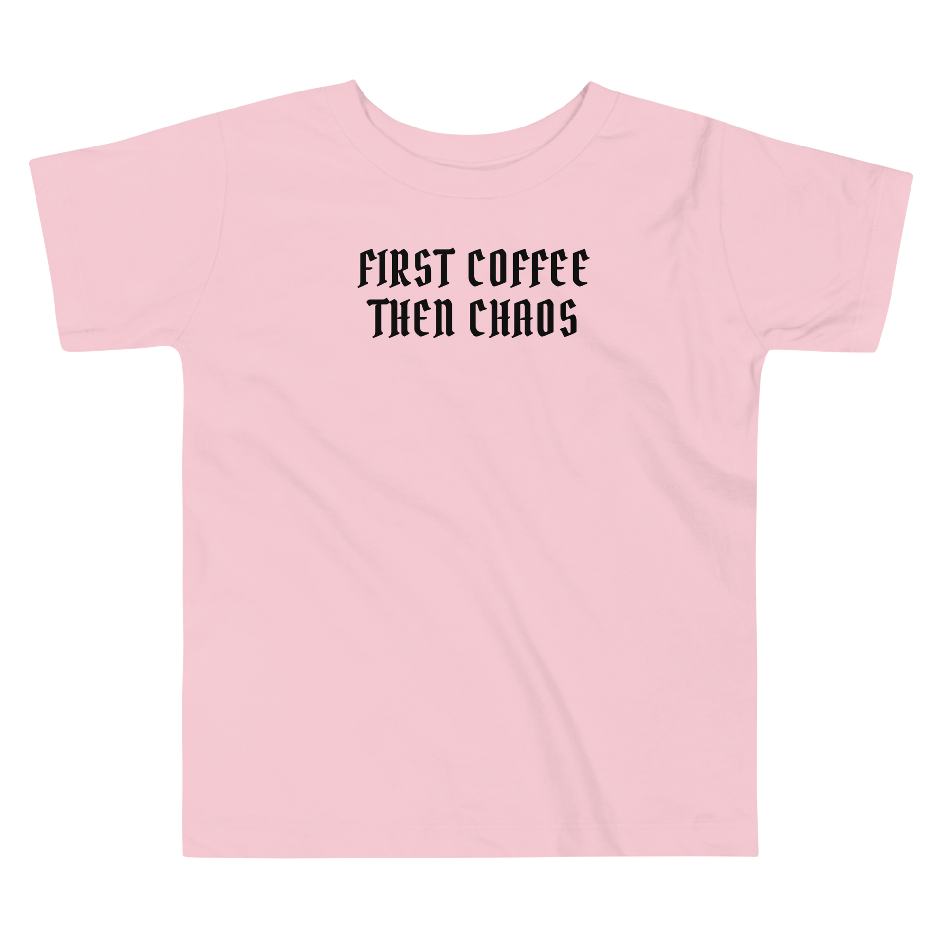 "First Coffee  Then Chaos" printed on a pink toddler short sleeve tee laying on a flat surface