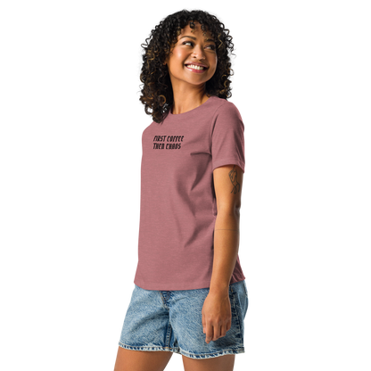 "First Coffee  Then Chaos" printed on a heather mauve women's relaxed t-shirt worn by a female