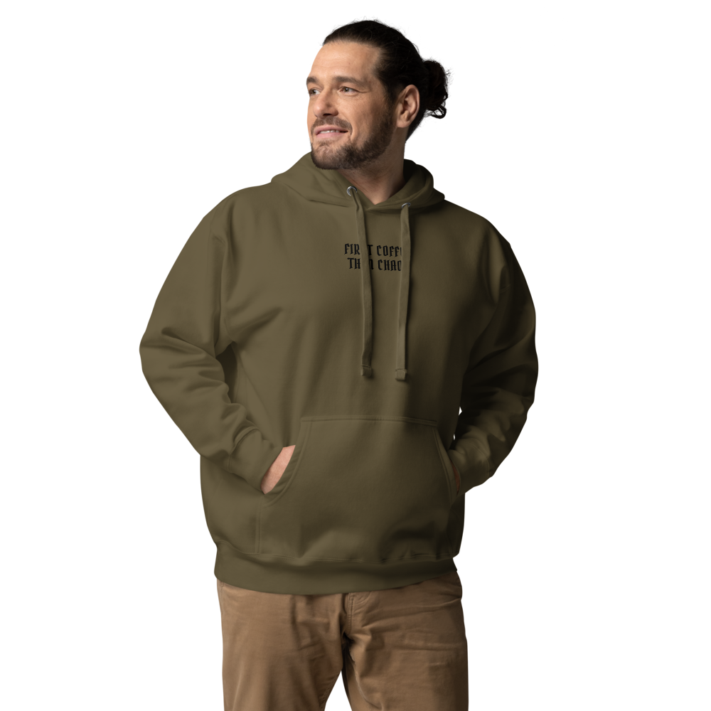 "First Coffee  Then Chaos" printed on a military green unisex hoodie worn by a male