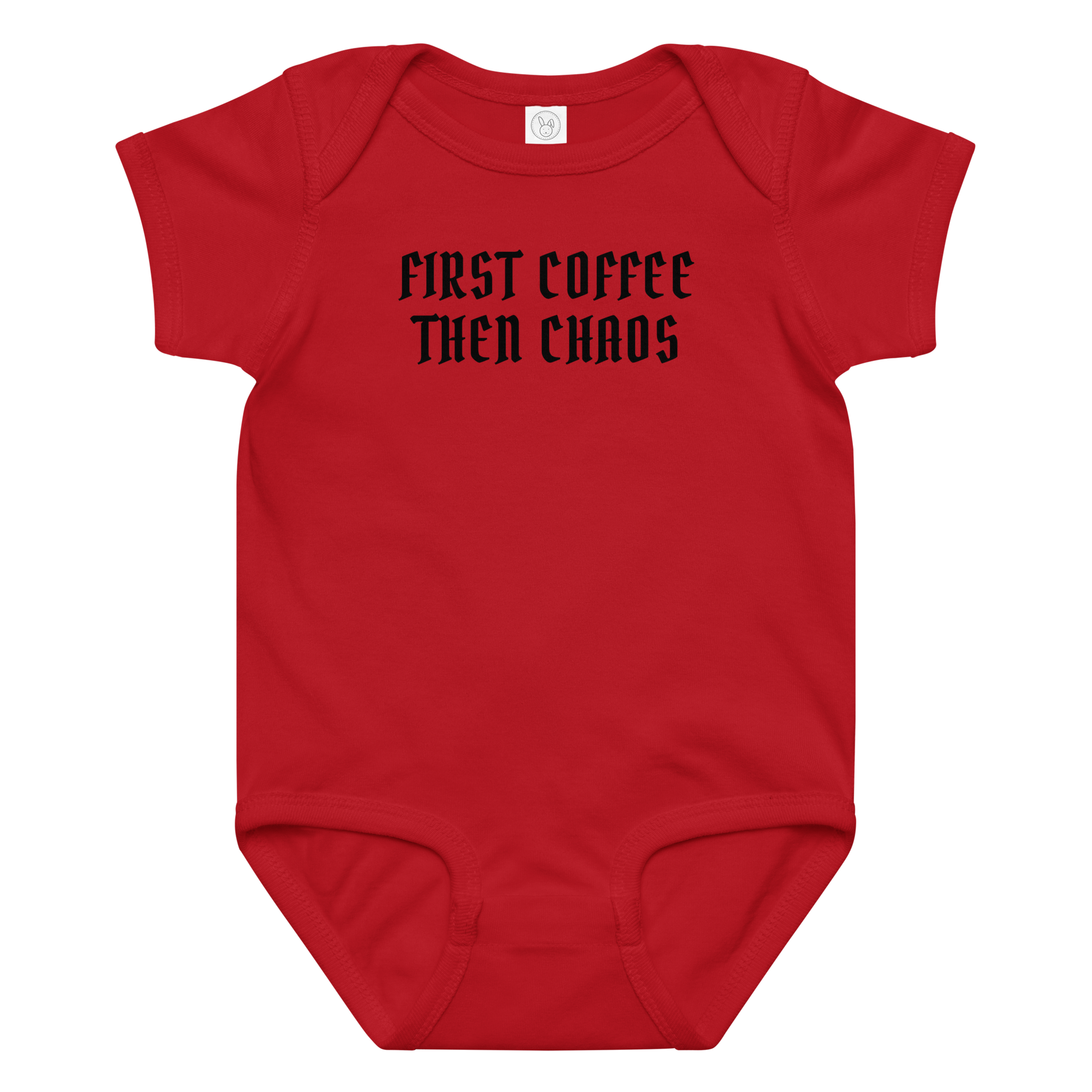 "First Coffee  Then Chaos" printed on a red baby jersey bodysuit laying on a flat surface amongst other clothes
