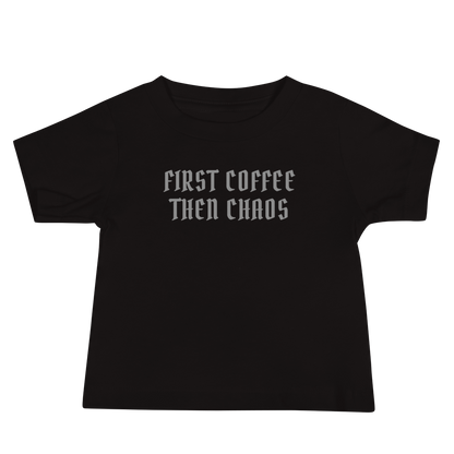 "First Coffee  Then Chaos" printed on a black baby jersey short sleeve tee laying on a flat surface