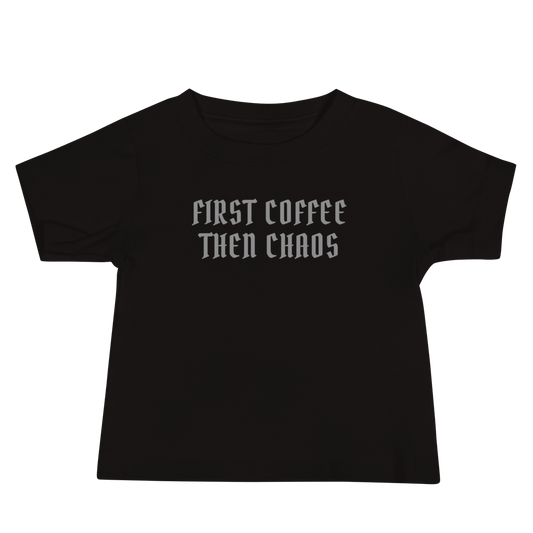 "First Coffee  Then Chaos" printed on a black baby jersey short sleeve tee laying on a flat surface