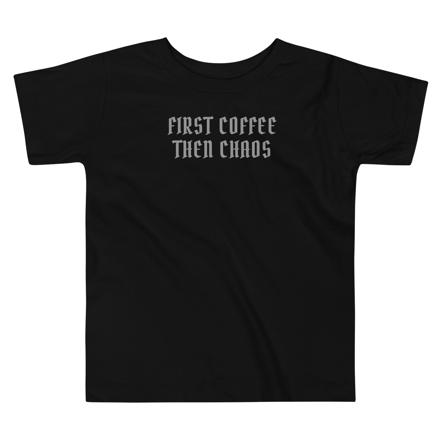 "First Coffee  Then Chaos" printed on a black toddler short sleeve tee laying on a flat surface