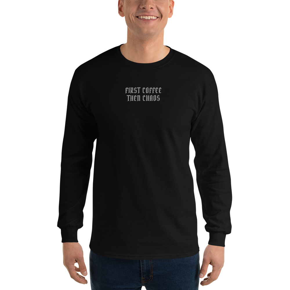 "First Coffee  Then Chaos" printed on a black men's long sleeve shirt worn by a male
