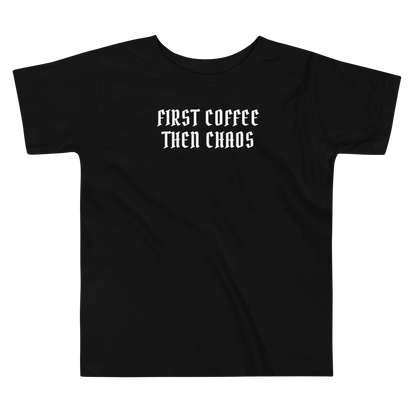 "First Coffee  Then Chaos" printed on a black toddler short sleeve tee laying on a flat surface