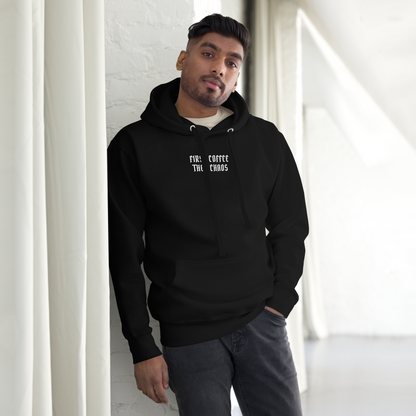 "First Coffee  Then Chaos" printed on a black unisex hoodie worn by a male
