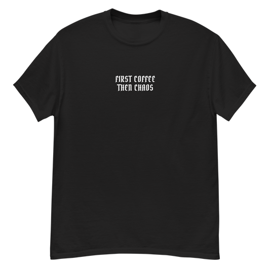 "First Coffee  Then Chaos" printed on a black unisex classic tee laying on a flat surface