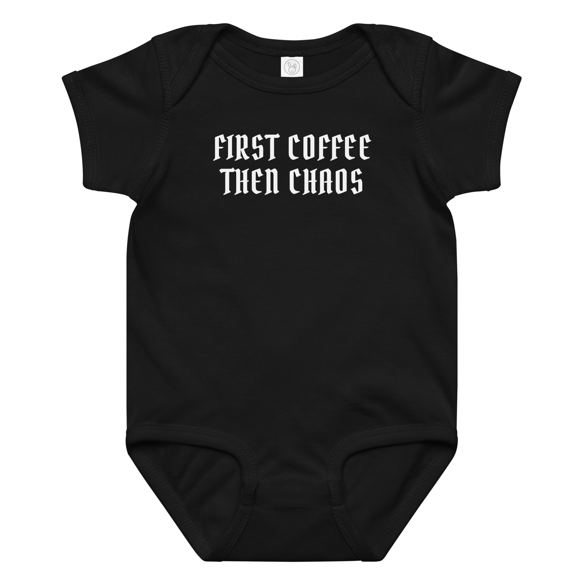 "First Coffee  Then Chaos" printed on a black baby jersey bodysuit laying on a flat surface amongst other clothes