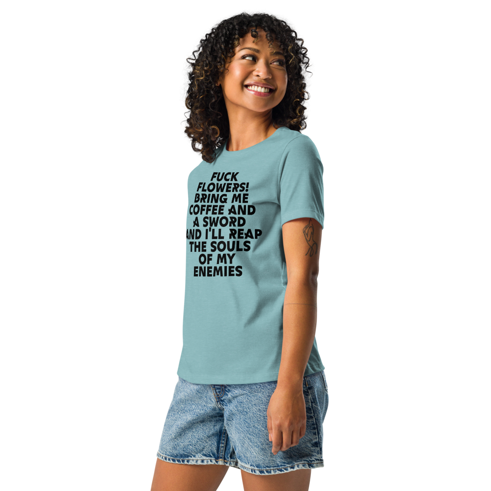 "Fuck Flowers! Bring Me Coffee And A Sword And I'll Reap The Souls Of My Enemies" printed on a heather blue lagoon women's relaxed t-shirt worn by a female