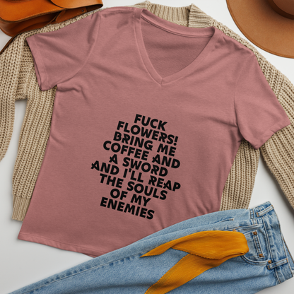"Fuck Flowers! Bring Me Coffee And A Sword And I'll Reap The Souls Of My Enemies" printed on a heather mauve women's relaxed v-neck t-shirt laying on a flat surface amongst other clothes