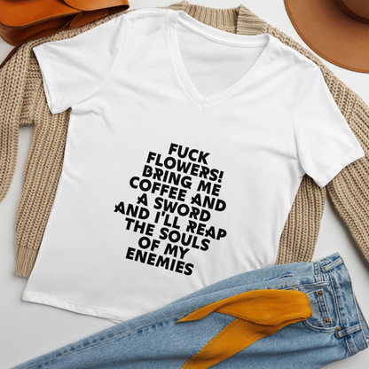 "Fuck Flowers! Bring Me Coffee And A Sword And I'll Reap The Souls Of My Enemies" printed on a solid white blend women's relaxed v-neck t-shirt laying on a flat surface amongst other clothes