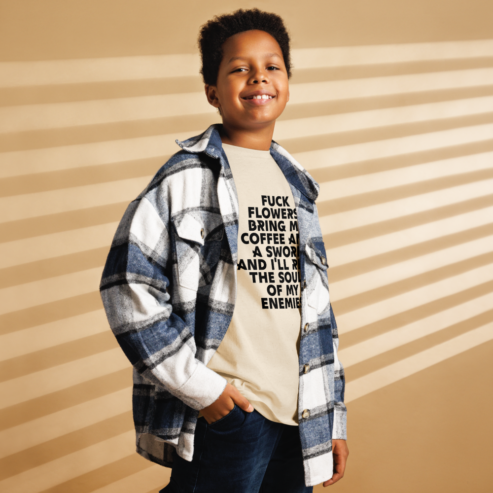 "Fuck Flowers! Bring Me Coffee And A Sword And I'll Reap The Souls Of My Enemies" printed on a natural youth classic tee worn by a male also wearing a jacket