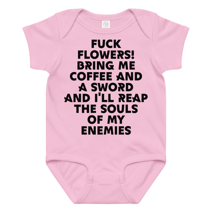 "Fuck Flowers! Bring Me Coffee And A Sword And I'll Reap The Souls Of My Enemies" printed on a pink baby jersey bodysuit laying on a flat surface amongst other clothes