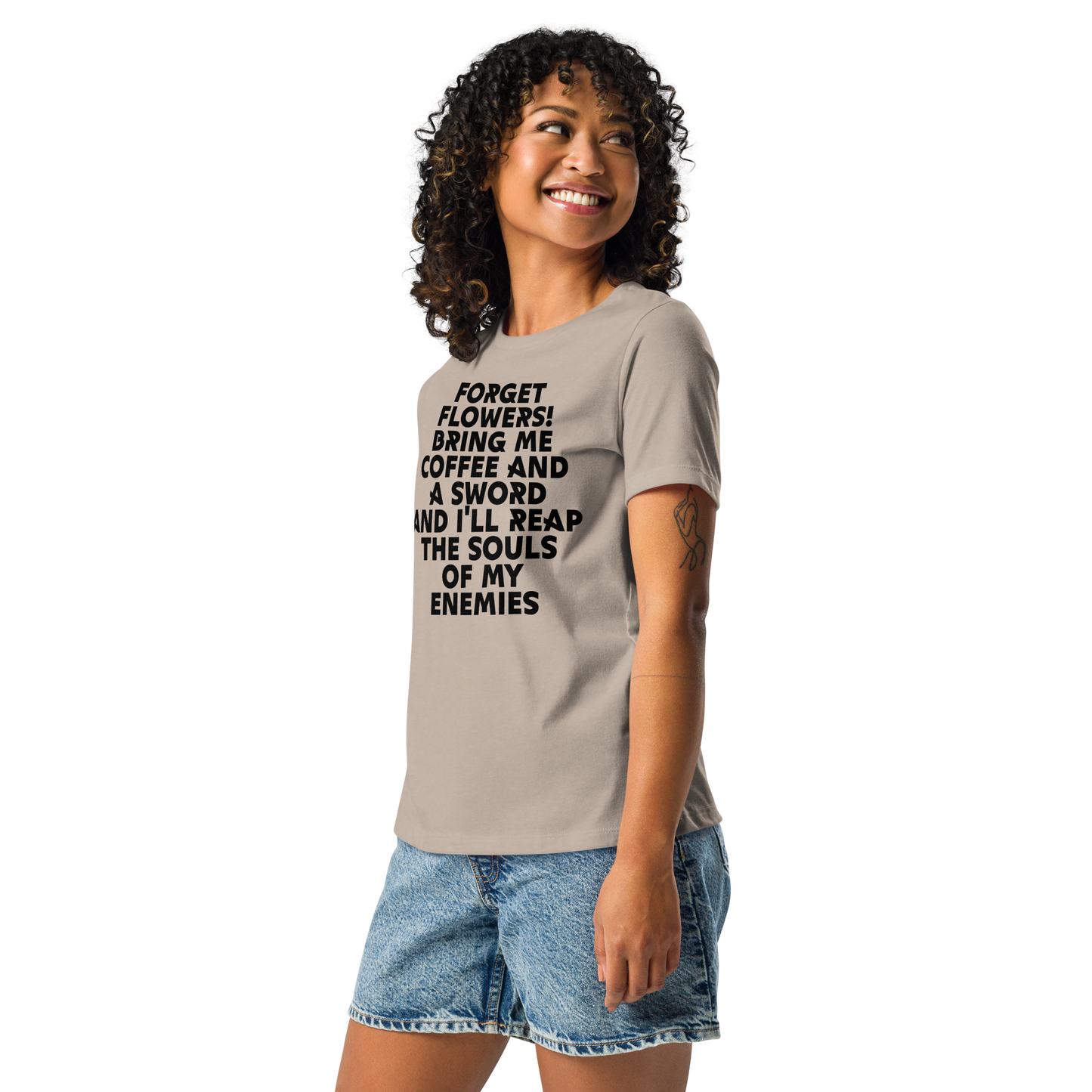 "Forget Flowers! Bring Me Coffee And A Sword And I'll Reap The Souls Of My Enemies" printed on a heather stone women's relaxed t-shirt worn by a female