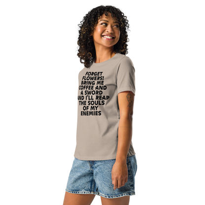 "Forget Flowers! Bring Me Coffee And A Sword And I'll Reap The Souls Of My Enemies" printed on a heather stone women's relaxed t-shirt worn by a female