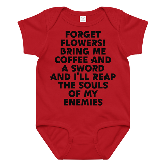 "Forget Flowers! Bring Me Coffee And A Sword And I'll Reap The Souls Of My Enemies" printed on a red baby jersey bodysuit laying on a flat surface amongst other clothes