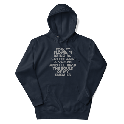 "Forget Flowers! Bring Me Coffee And A Sword And I'll Reap The Souls Of My Enemies" printed on a navy blazer unisex hoodie laying on a flat surface with the hood up
