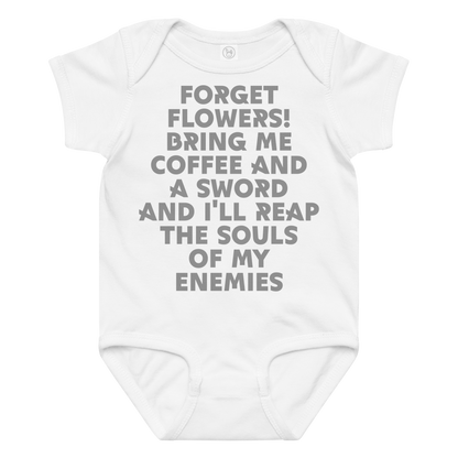 "Forget Flowers! Bring Me Coffee And A Sword And I'll Reap The Souls Of My Enemies" printed on a white baby jersey bodysuit laying on a flat surface amongst other clothes