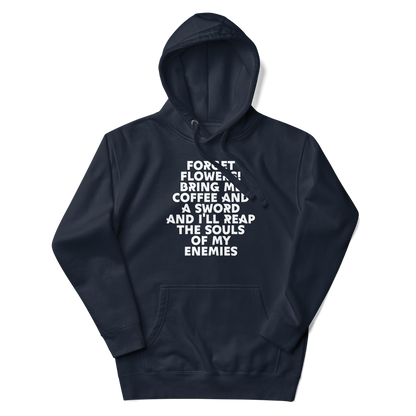 "Forget Flowers! Bring Me Coffee And A Sword And I'll Reap The Souls Of My Enemies" printed on a navy blazer unisex hoodie laying on a flat surface with the hood up