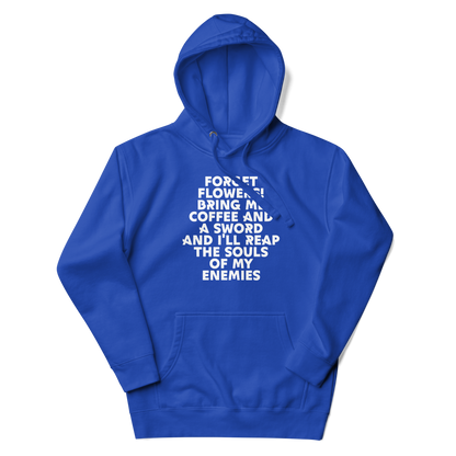 "Forget Flowers! Bring Me Coffee And A Sword And I'll Reap The Souls Of My Enemies" printed on a team royal unisex hoodie laying on a flat surface with the hood up