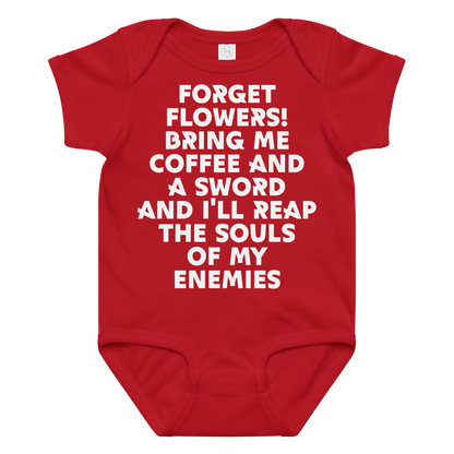 "Forget Flowers! Bring Me Coffee And A Sword And I'll Reap The Souls Of My Enemies" printed on a red baby jersey bodysuit laying on a flat surface amongst other clothes