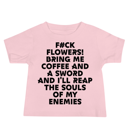 "F#Ck Flowers! Bring Me Coffee And A Sword And I'll Reap The Souls Of My Enemies" printed on a pink baby jersey short sleeve tee laying on a flat surface