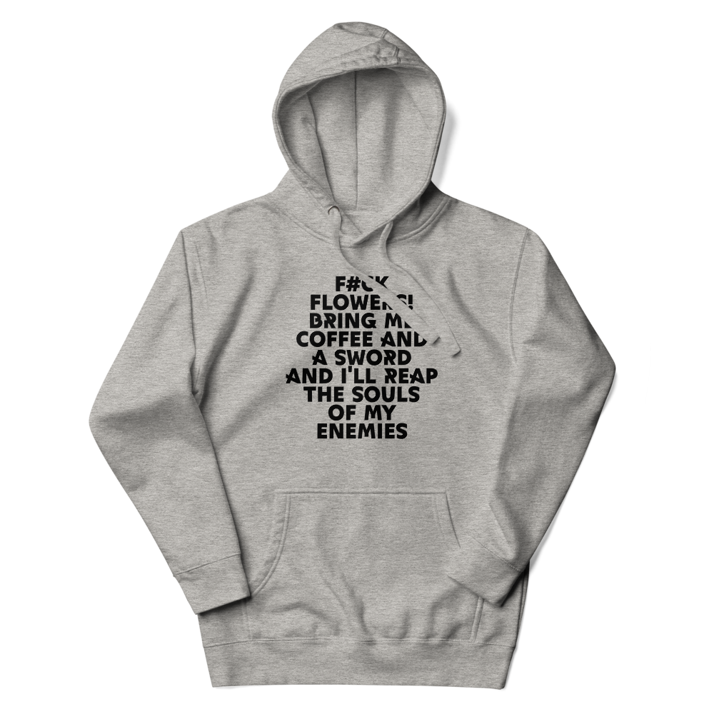 "F#Ck Flowers! Bring Me Coffee And A Sword And I'll Reap The Souls Of My Enemies" printed on a carbon grey unisex hoodie laying on a flat surface with the hood up