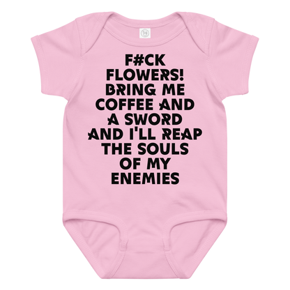 "F#Ck Flowers! Bring Me Coffee And A Sword And I'll Reap The Souls Of My Enemies" printed on a pink baby jersey bodysuit laying on a flat surface amongst other clothes