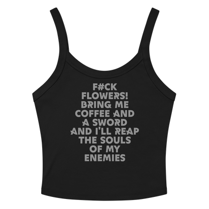 "F#Ck Flowers! Bring Me Coffee And A Sword And I'll Reap The Souls Of My Enemies" printed on a solid black blend women's micro-rib tanktop laying on a flat surface amongst sunglasses and shorts