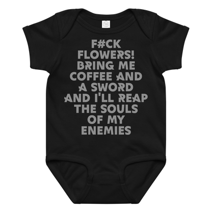 "F#Ck Flowers! Bring Me Coffee And A Sword And I'll Reap The Souls Of My Enemies" printed on a black baby jersey bodysuit laying on a flat surface amongst other clothes