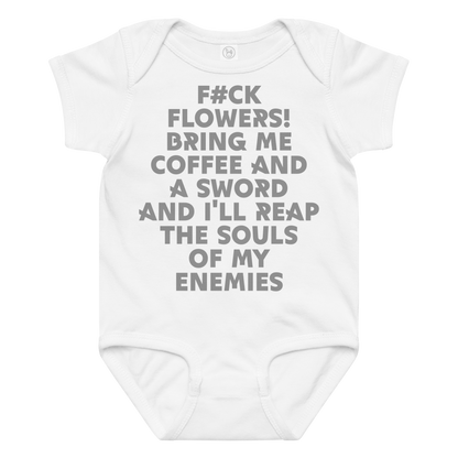 "F#Ck Flowers! Bring Me Coffee And A Sword And I'll Reap The Souls Of My Enemies" printed on a white baby jersey bodysuit laying on a flat surface amongst other clothes