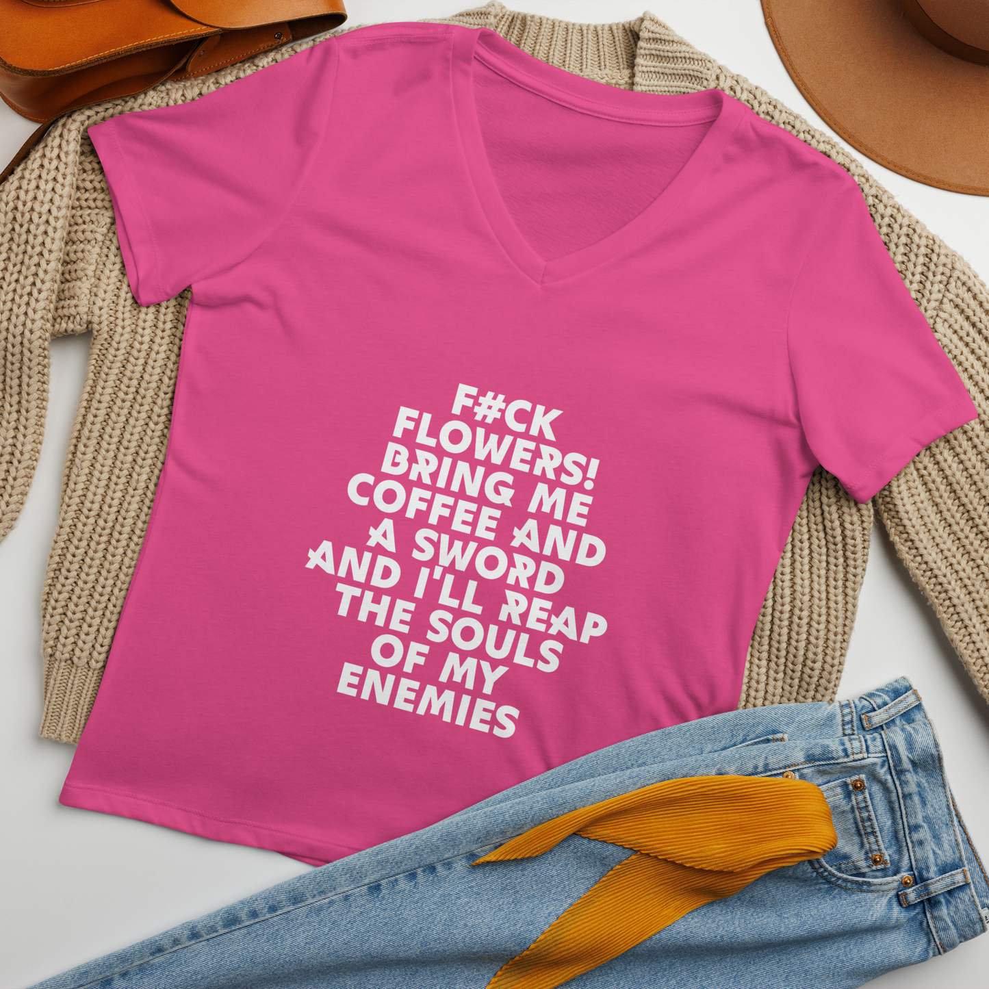 "F#Ck Flowers! Bring Me Coffee And A Sword And I'll Reap The Souls Of My Enemies" printed on a berry women's relaxed v-neck t-shirt laying on a flat surface amongst other clothes