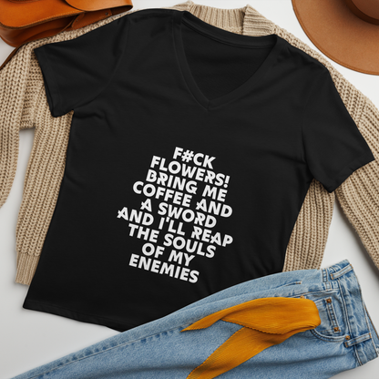 "F#Ck Flowers! Bring Me Coffee And A Sword And I'll Reap The Souls Of My Enemies" printed on a solid black blend women's relaxed v-neck t-shirt laying on a flat surface amongst other clothes
