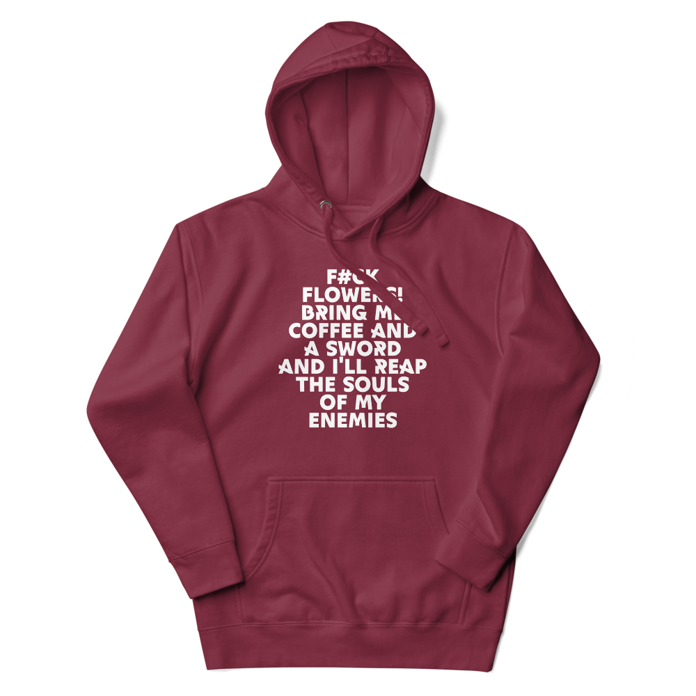 "F#Ck Flowers! Bring Me Coffee And A Sword And I'll Reap The Souls Of My Enemies" printed on a maroon unisex hoodie laying on a flat surface with the hood up