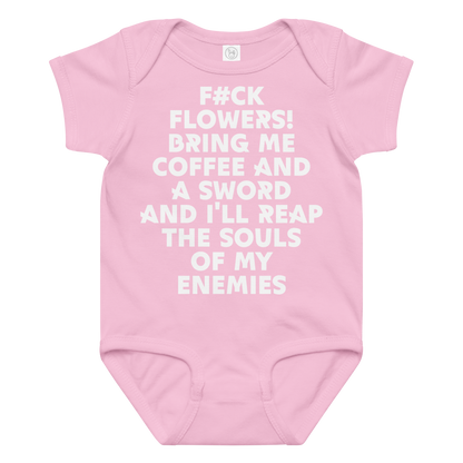 "F#Ck Flowers! Bring Me Coffee And A Sword And I'll Reap The Souls Of My Enemies" printed on a pink baby jersey bodysuit laying on a flat surface amongst other clothes