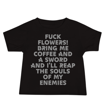 "Fuck Flowers! Bring Me Coffee And A Sword And I'll Reap The Souls Of My Enemies" printed on a black baby jersey short sleeve tee laying on a flat surface