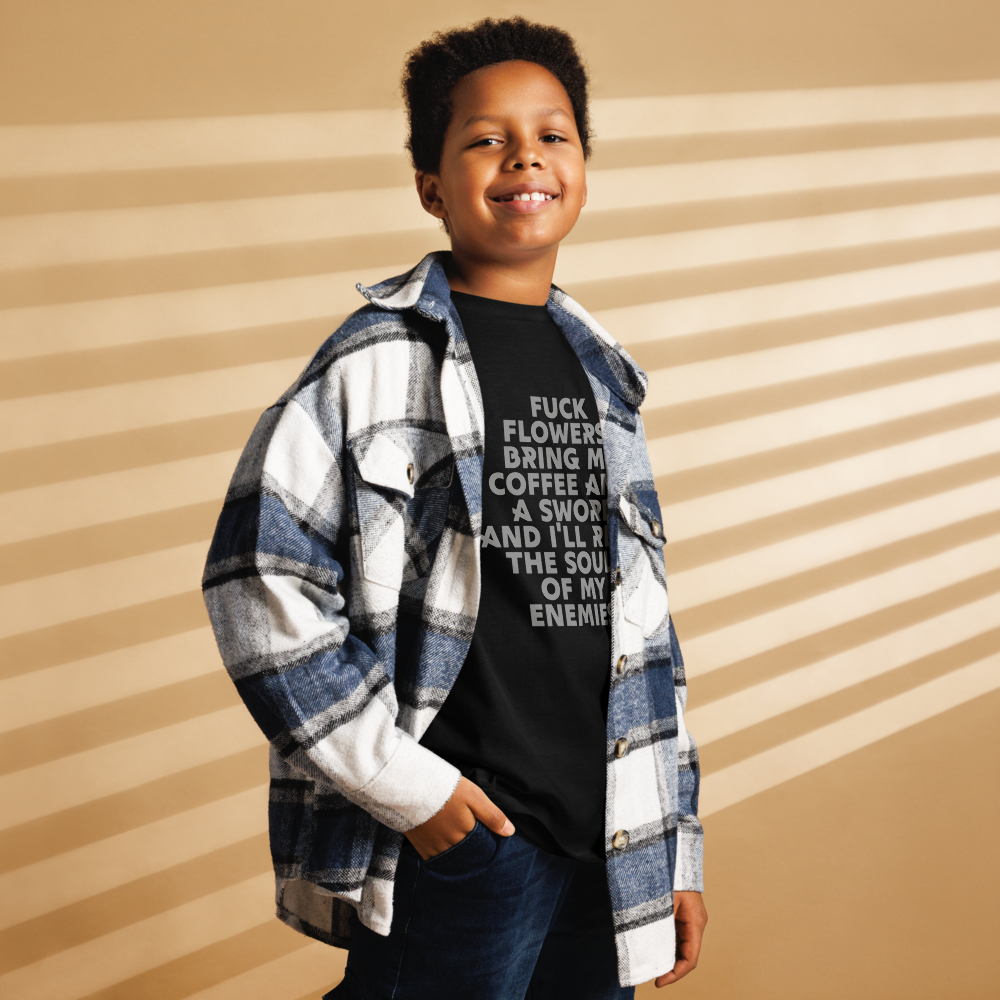 "Fuck Flowers! Bring Me Coffee And A Sword And I'll Reap The Souls Of My Enemies" printed on a black youth classic tee worn by a male also wearing a jacket