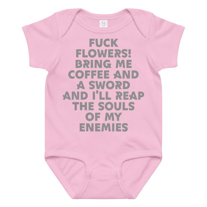 "Fuck Flowers! Bring Me Coffee And A Sword And I'll Reap The Souls Of My Enemies" printed on a pink baby jersey bodysuit laying on a flat surface amongst other clothes