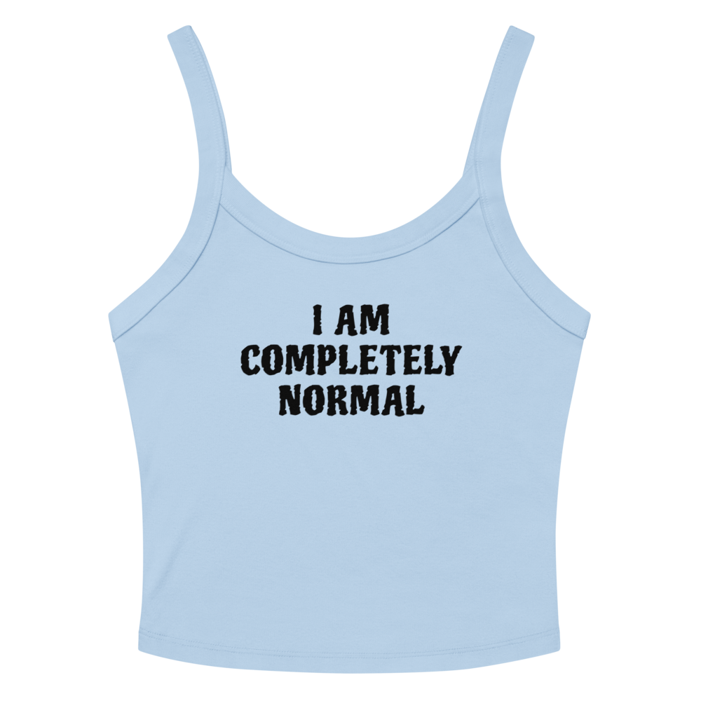 "I am completely normal" printed on a solid baby blue blend women's micro-rib tanktop laying on a flat surface amongst sunglasses and shorts