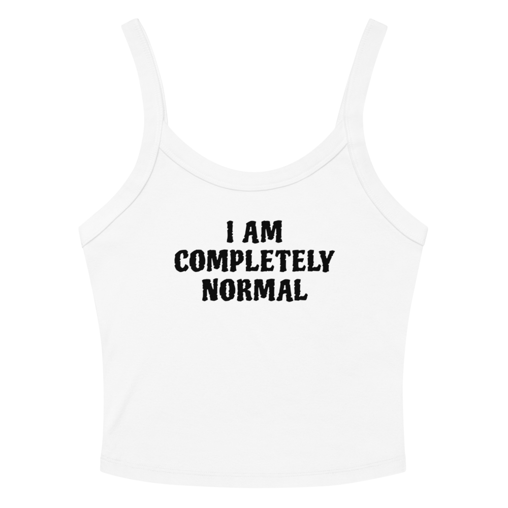 "I am completely normal" printed on a solid white blend women's micro-rib tanktop laying on a flat surface amongst sunglasses and shorts