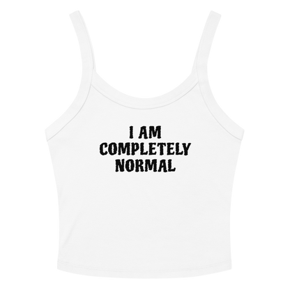 "I am completely normal" printed on a solid white blend women's micro-rib tanktop laying on a flat surface amongst sunglasses and shorts