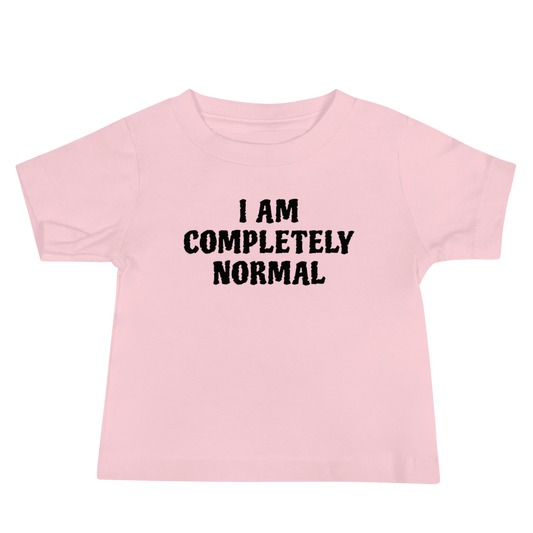 "I am completely normal" printed on a pink baby jersey short sleeve tee laying on a flat surface