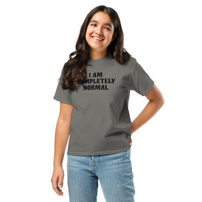 "I am completely normal" printed on a charcoal youth classic tee worn by a female