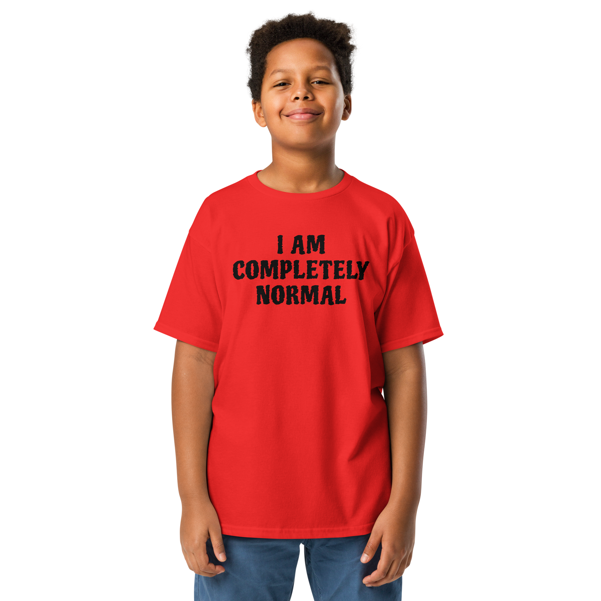 "I am completely normal" printed on a red youth classic tee worn by a male