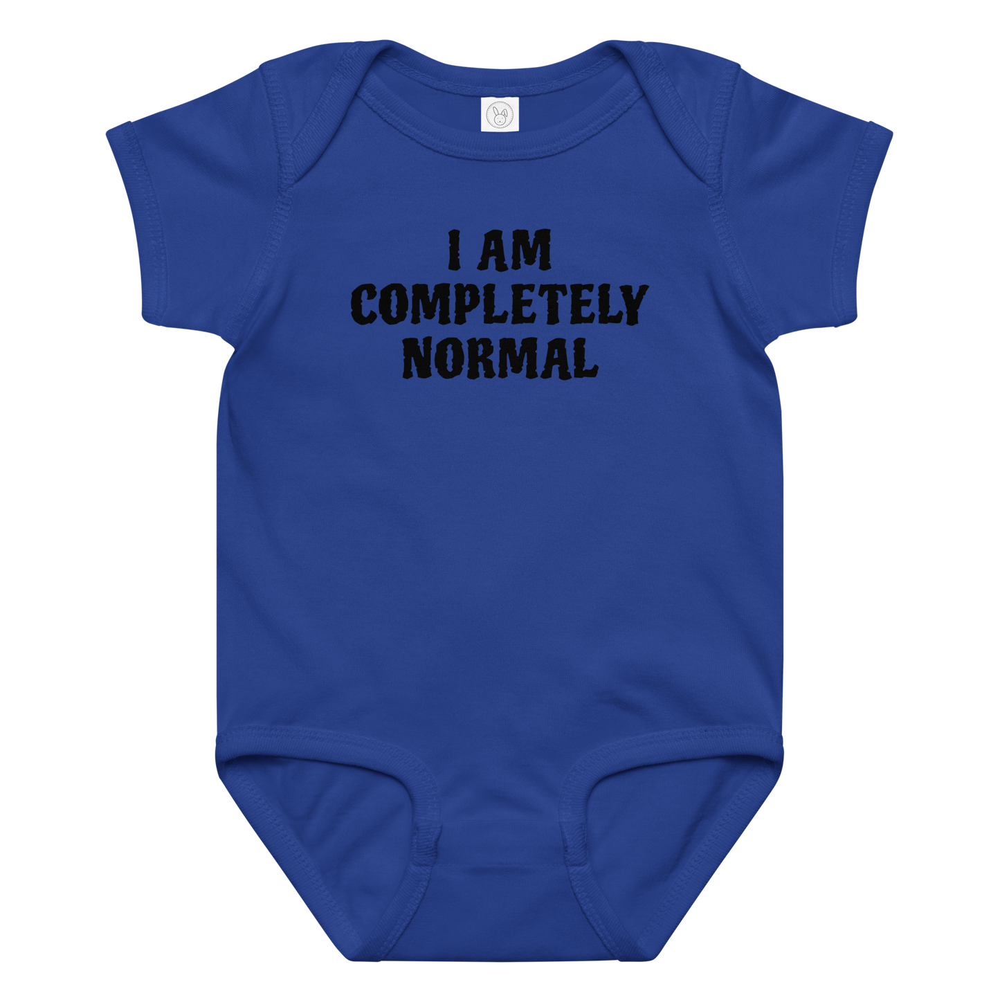 "I am completely normal" printed on a royal baby jersey bodysuit laying on a flat surface amongst other clothes