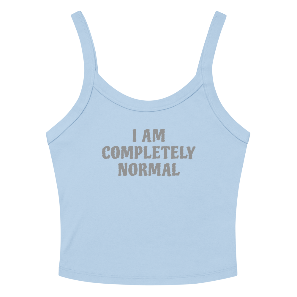 "I am completely normal" printed on a solid baby blue blend women's micro-rib tanktop laying on a flat surface amongst sunglasses and shorts
