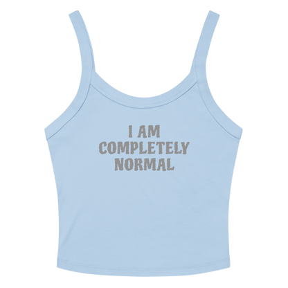 "I am completely normal" printed on a solid baby blue blend women's micro-rib tanktop laying on a flat surface amongst sunglasses and shorts