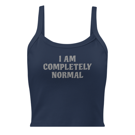 "I am completely normal" printed on a solid navy blend women's micro-rib tanktop laying on a flat surface